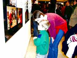 Martina, former model in studio painting with her son