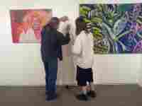 Prof. Merta gives a lecture sign to student book of Lukáš Hladík. LOL